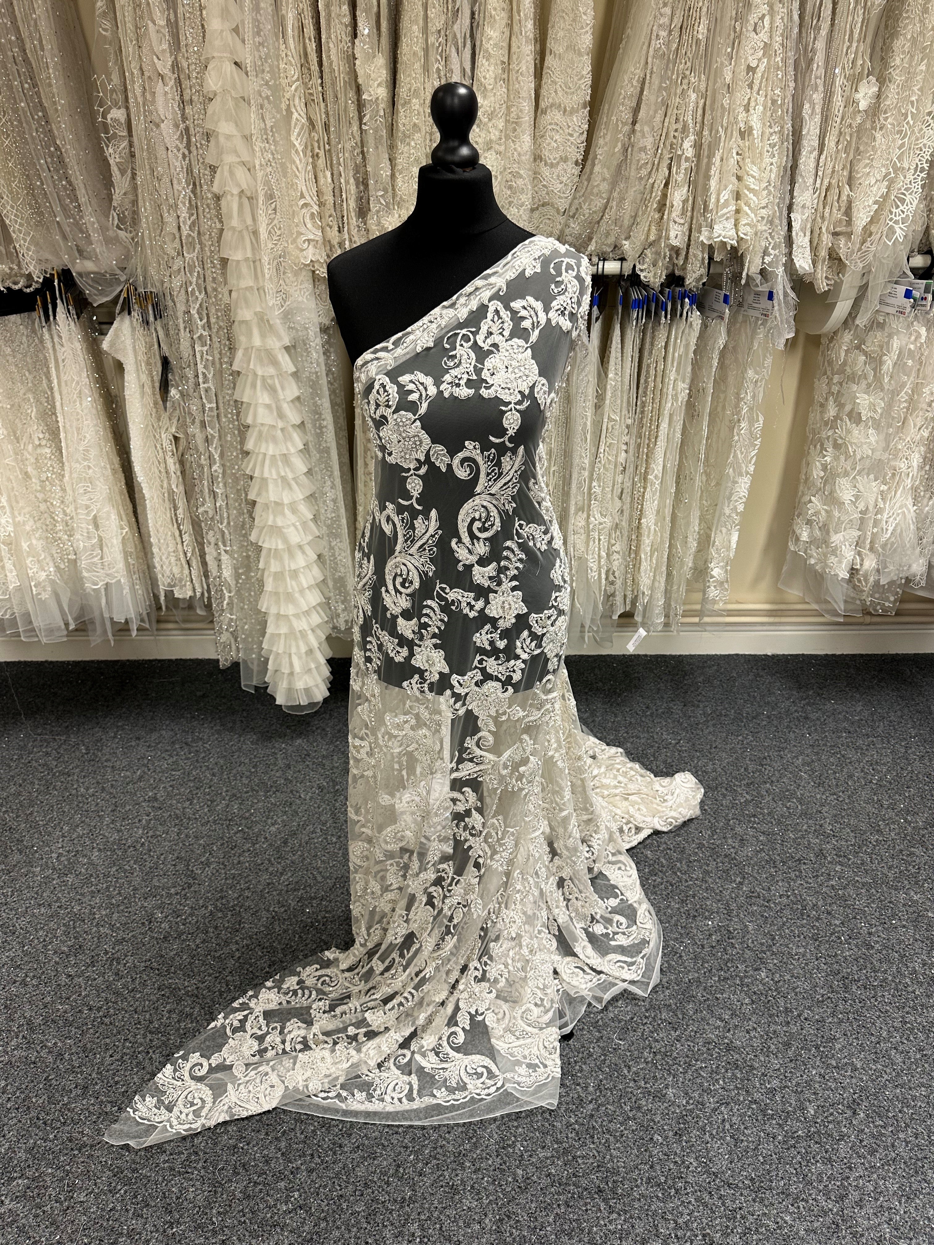 Shakira is an eye catching Ivory Beaded Lace – Shakira