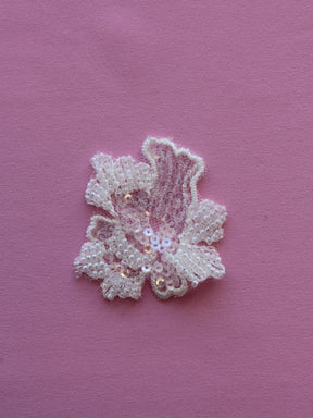 beaded flower motif in ivory